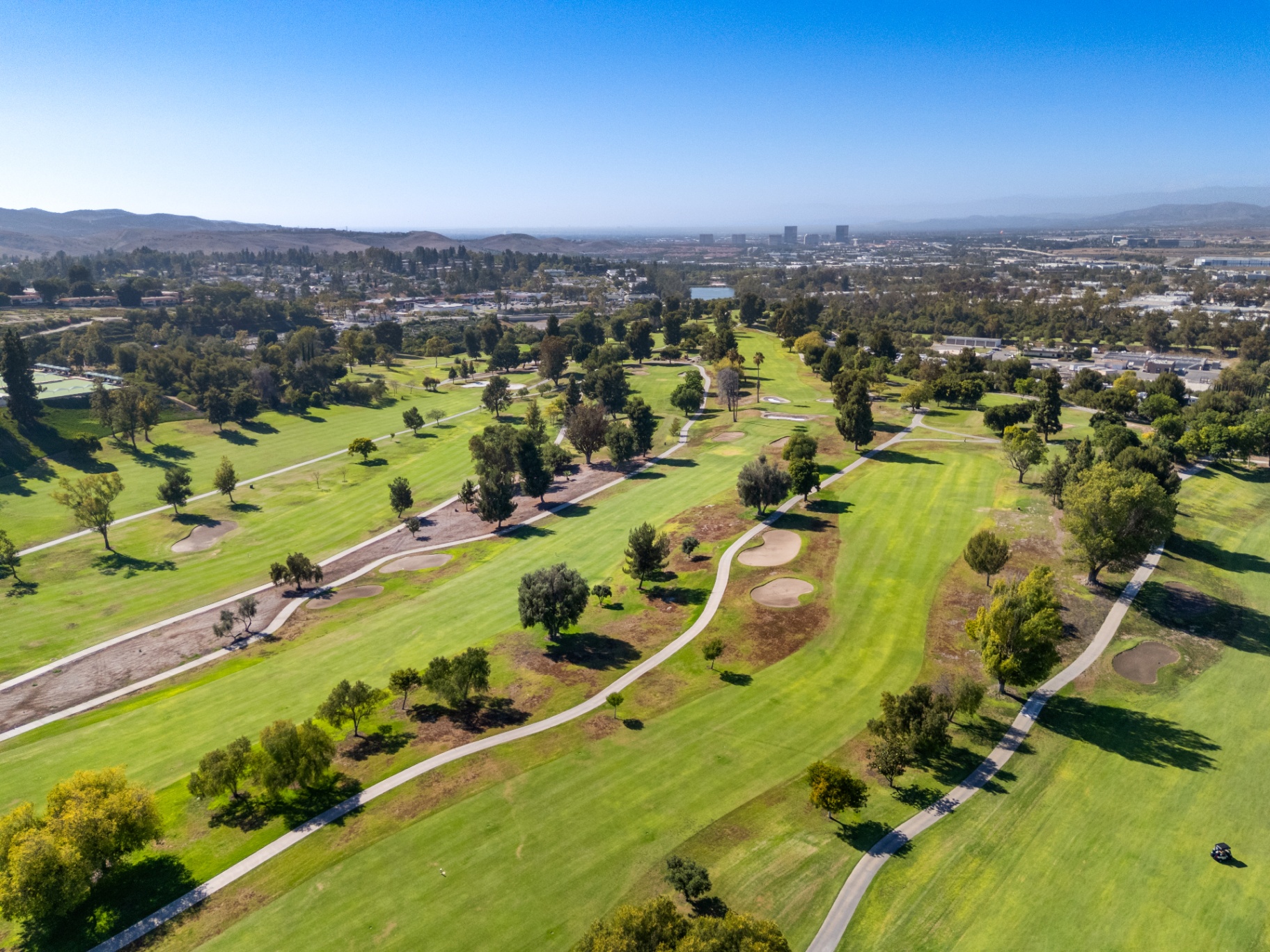 Aerial view across the golf course fairways and surrounding hills