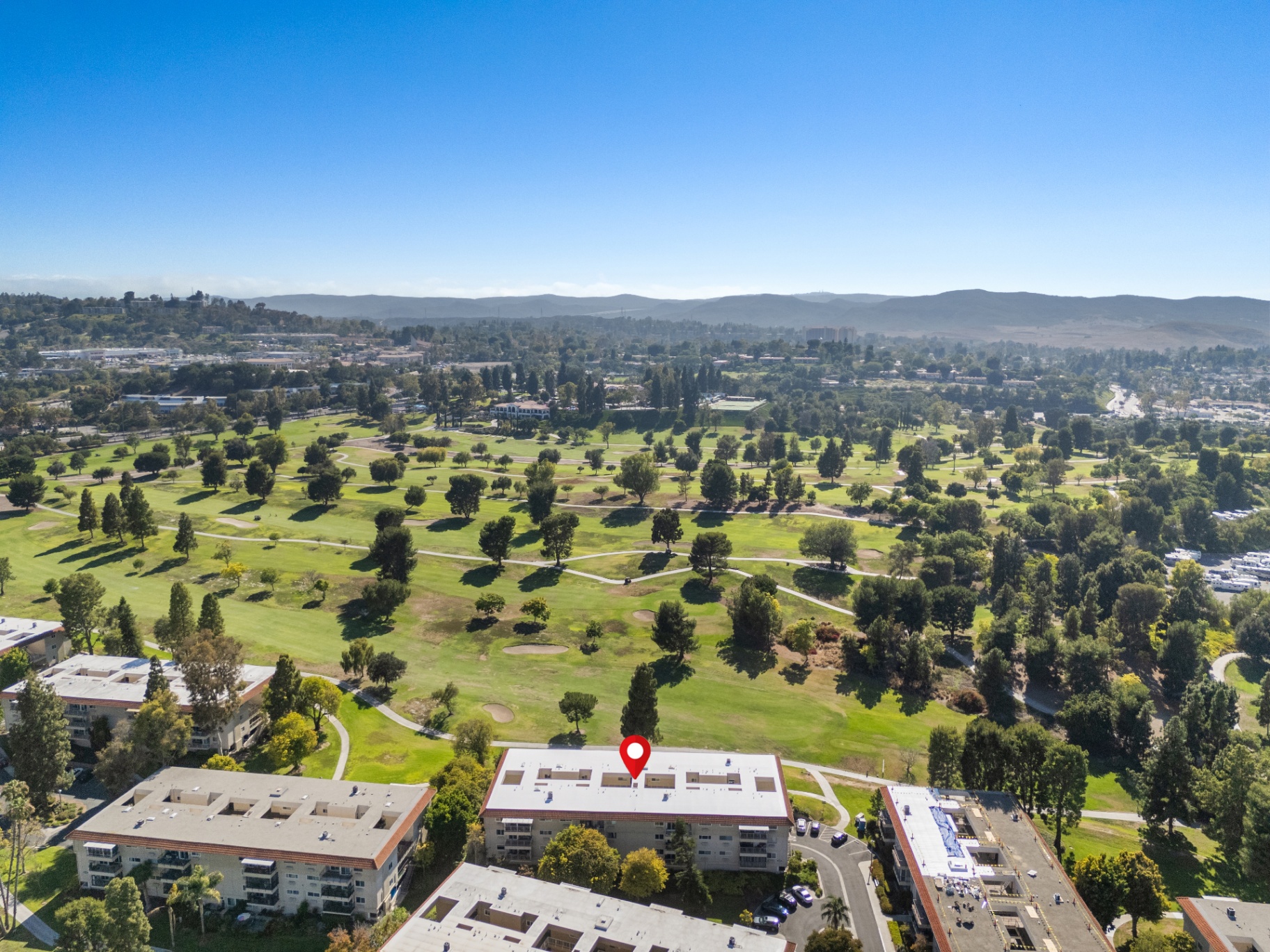 Aerial view looking across the expansive golf course from the building