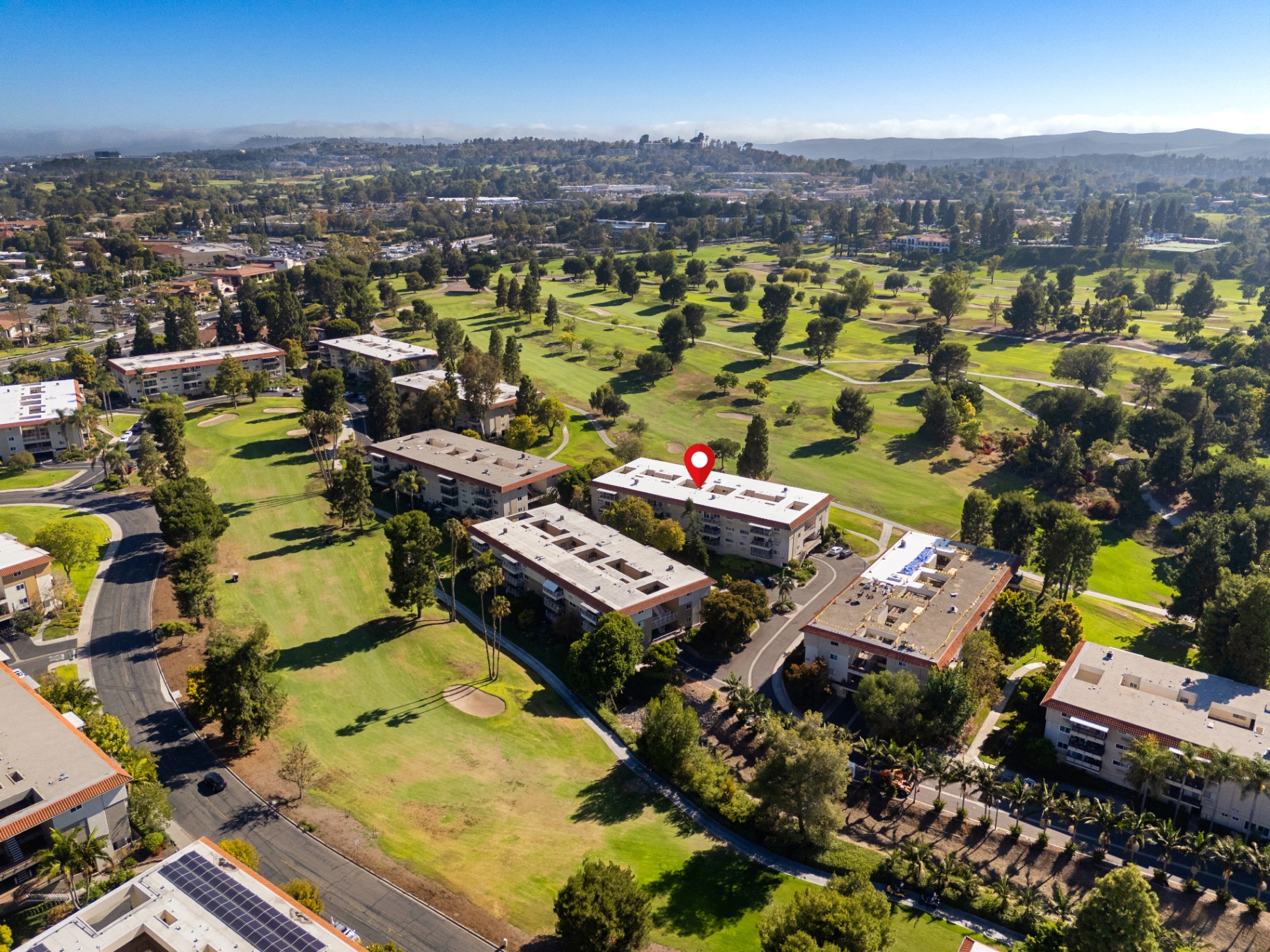 Aerial view over the golf course fairways beside the building