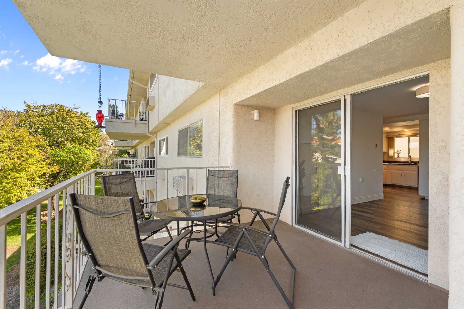 Balcony sitting area with sliding door to kitchen