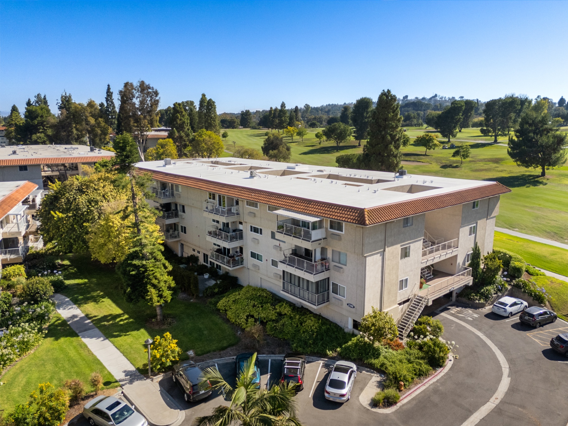 Aerial building view with the golf course directly behind